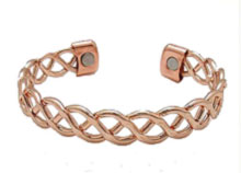 An open-weave copper bangle with two healing magnets